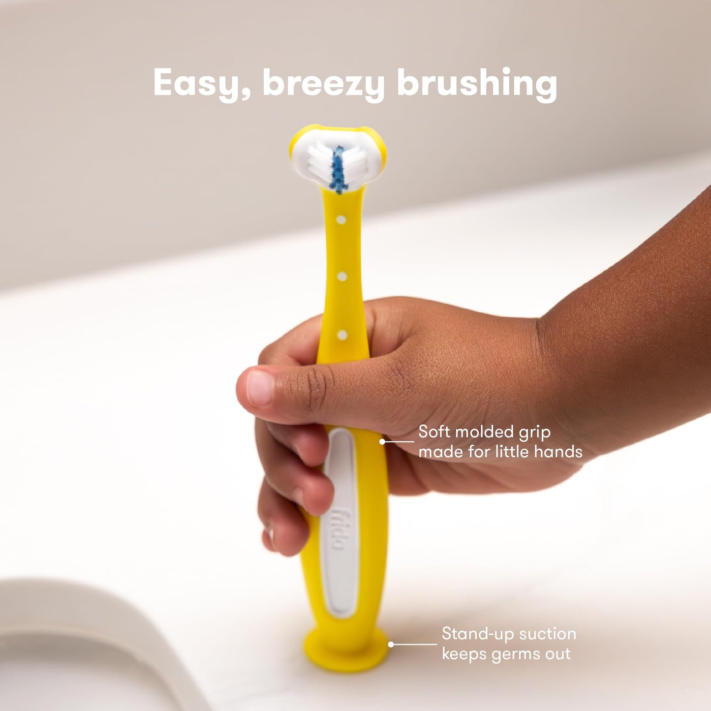 Frida Baby Triple-Angle Toothhugger Training Toddler Toothbrush | Toddler Toothbrush 2 Years and Up, Cleans All Sides at Once | Pink