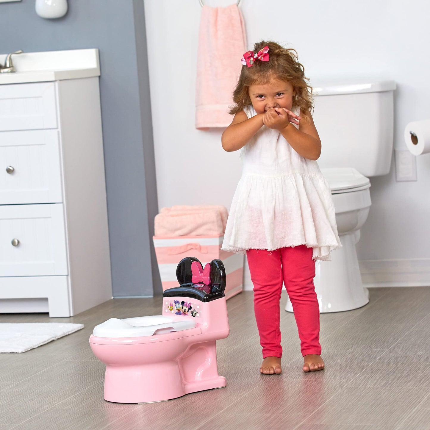 The First Years Disney Minnie Mouse Potty Training Toilet and Toddler Toilet Seat - Toilet Training Potty with Fun Flushing and Cheering Sounds,Pink