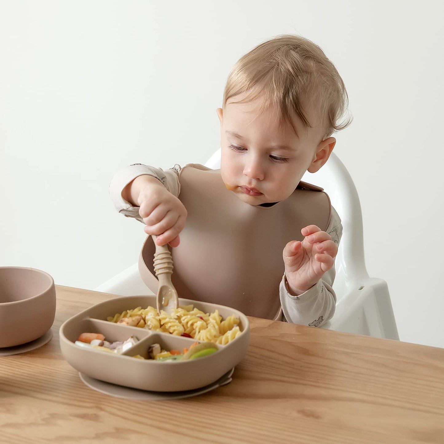 SAMiGO Silicone Baby Utensils - Self Feeding Spoons and Tiny Training Cup - First Stage Baby Led Weaning Supplies for 6 Months+ Infants - Set of 3