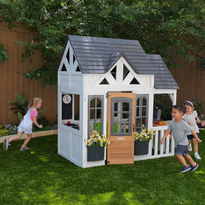 KidKraft Lantana Lane Outdoor Wooden Playhouse with Kitchen and Flap Door