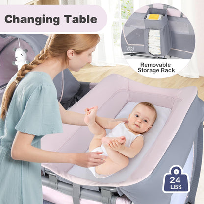 BABY JOY 5 in 1 Pack and Play, Portable Baby Playard w/Bassinet & Diaper Changing Table, Infant Pink Bassinet Crib with Toys & Music & Oxford Bag for Baby Girl Toddlers (Pink + Purple, Starry Sky)