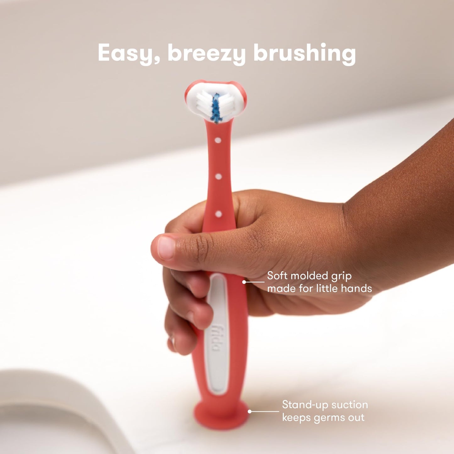 Frida Baby Triple-Angle Toothhugger Training Toddler Toothbrush | Toddler Toothbrush 2 Years and Up, Cleans All Sides at Once | Pink