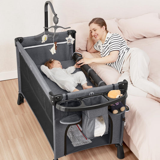 ANGELBLISS 5 in 1 Baby Bassinet, Bedside Crib & Playpen, Pack and Play Bassinet with Diaper Changer and Removable Rocker, Easy Folding Portable Crib with Mobile, Sheet & Mattress (Grey)