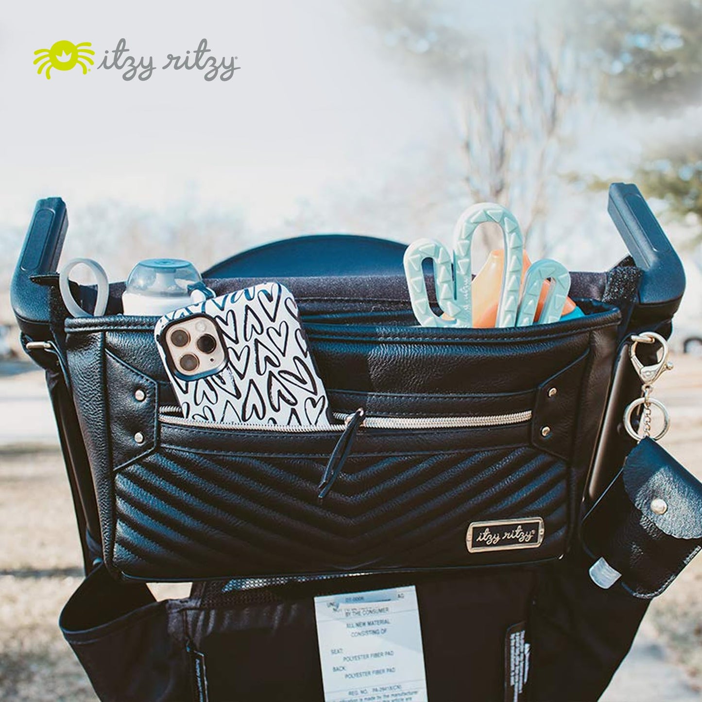 Itzy Ritzy Adjustable Stroller Caddy and Organizer Bag Featuring Front Zippered Pocket, 2 Built-in Interior Pockets & Adjustable Straps to Fit Nearly Any Stroller (Chai)